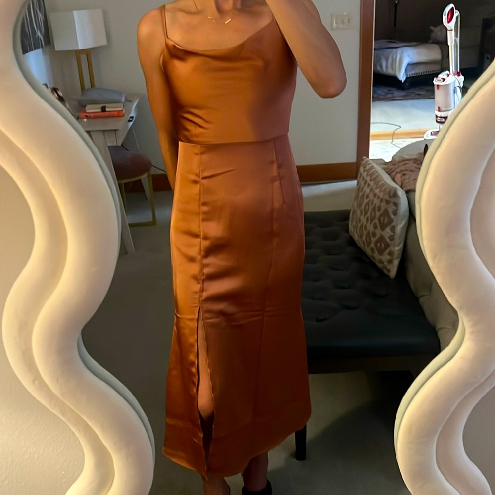 Flattering with above the knee slit. I am 5’5” and 120 lbs as a reference.